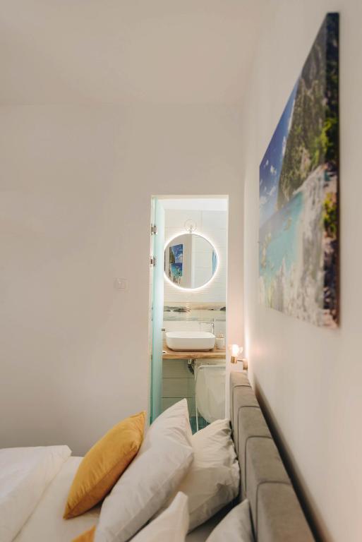Postel nebo postele na pokoji v ubytování Sunrise Guesthouse