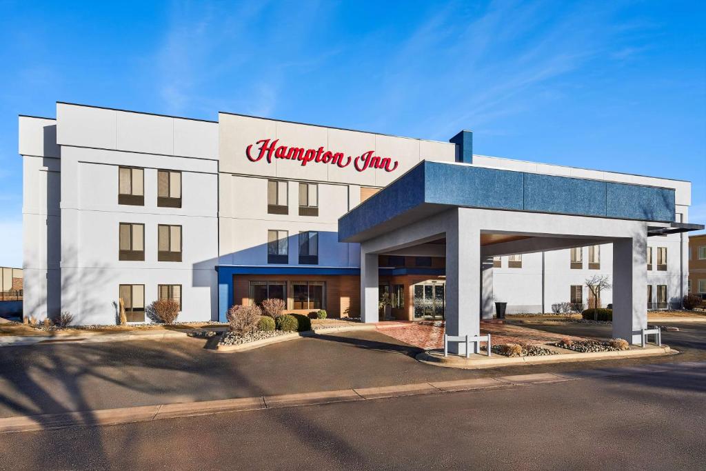 a hampton inn sign on the front of a building at Hampton Inn Longmont in Longmont