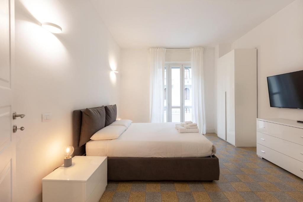 A bed or beds in a room at Gaffurio Apartments