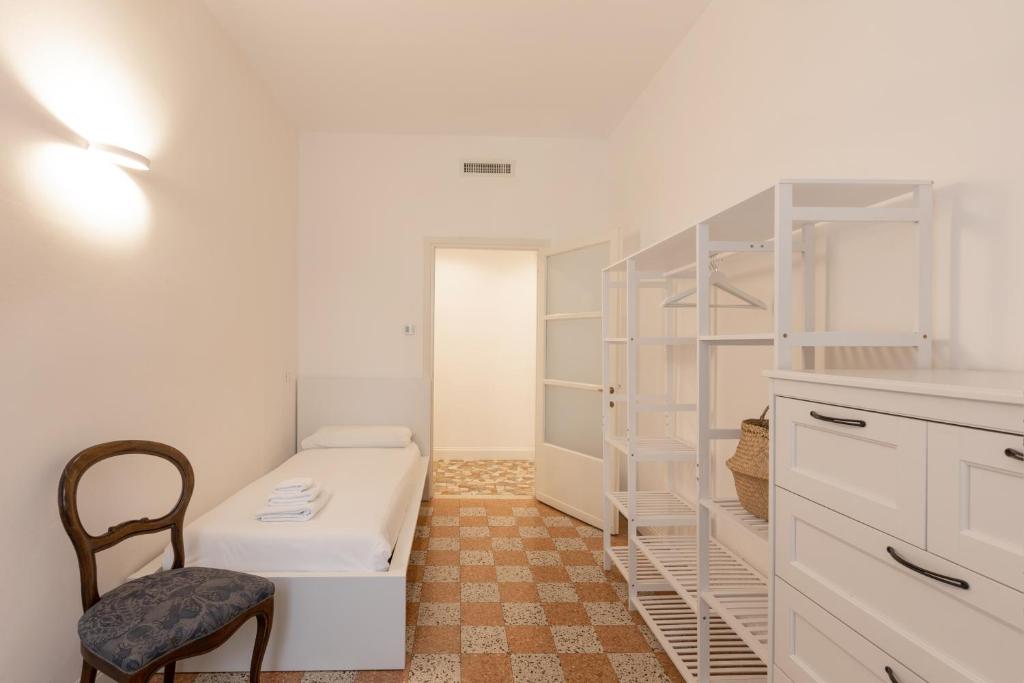 A bed or beds in a room at Gaffurio Apartments