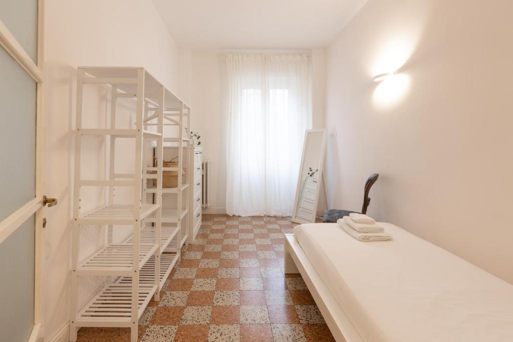 A bed or beds in a room at Gaffurio Apartments