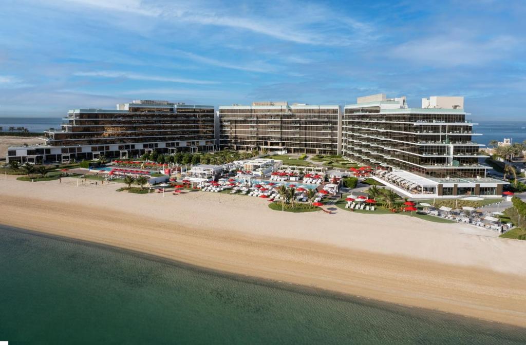 an aerial view of a resort on the beach at Th8 Palm Dubai Beach Resort Vignette Collection, an IHG hotel in Dubai