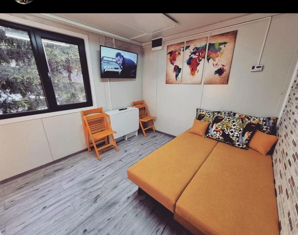 Postel nebo postele na pokoji v ubytování Tiny House Căsuța cocoțată - Valea Doftanei - 2camere