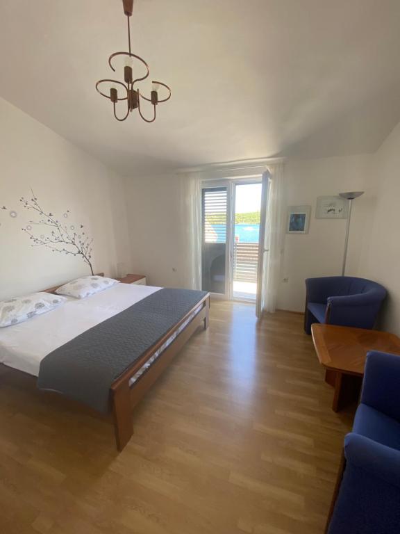 Postel nebo postele na pokoji v ubytování ŠPARADIĆI