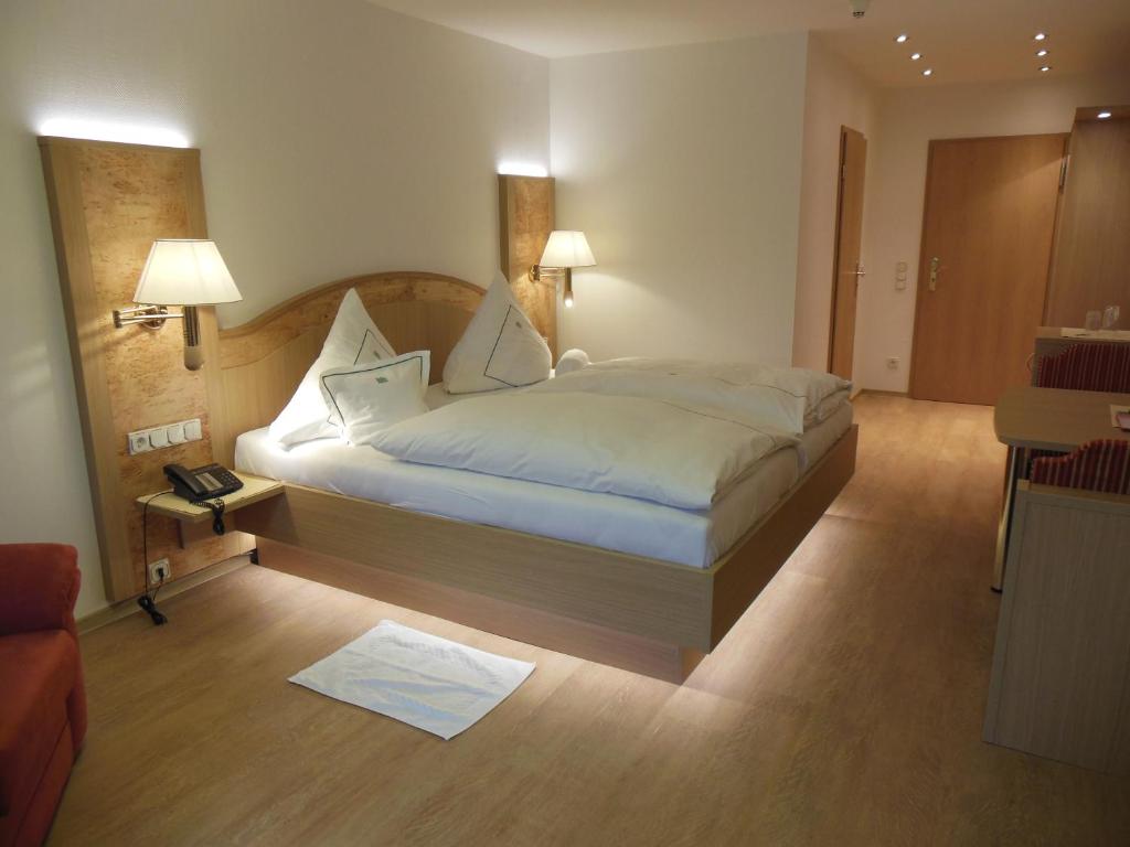 Postel nebo postele na pokoji v ubytování Hotel Mühlenthal GmbH