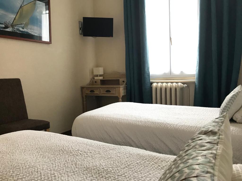 Postel nebo postele na pokoji v ubytování Logis Hôtel & Restaurant "Au Gré du Vent"