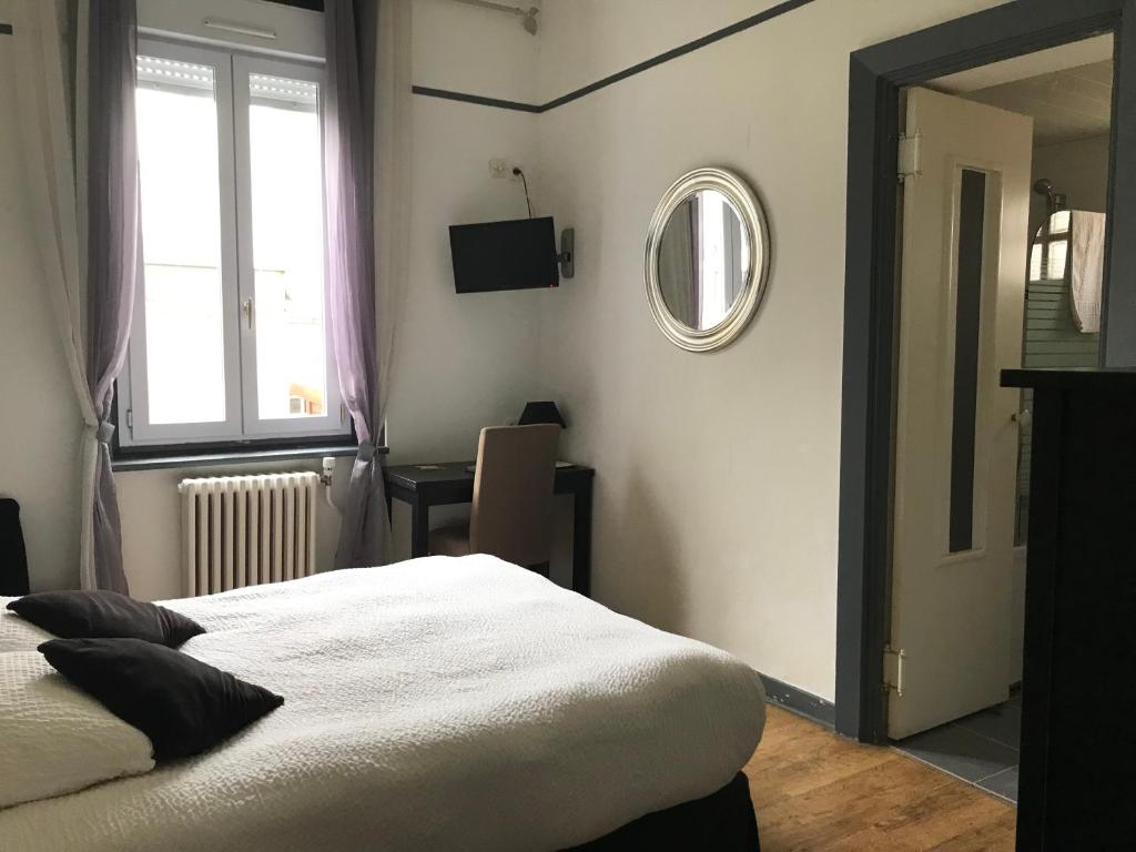 Postel nebo postele na pokoji v ubytování Logis Hôtel & Restaurant "Au Gré du Vent"