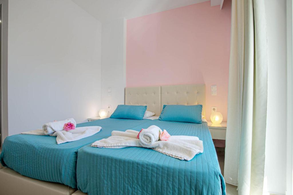 Postel nebo postele na pokoji v ubytování Palotel Design Gouvia