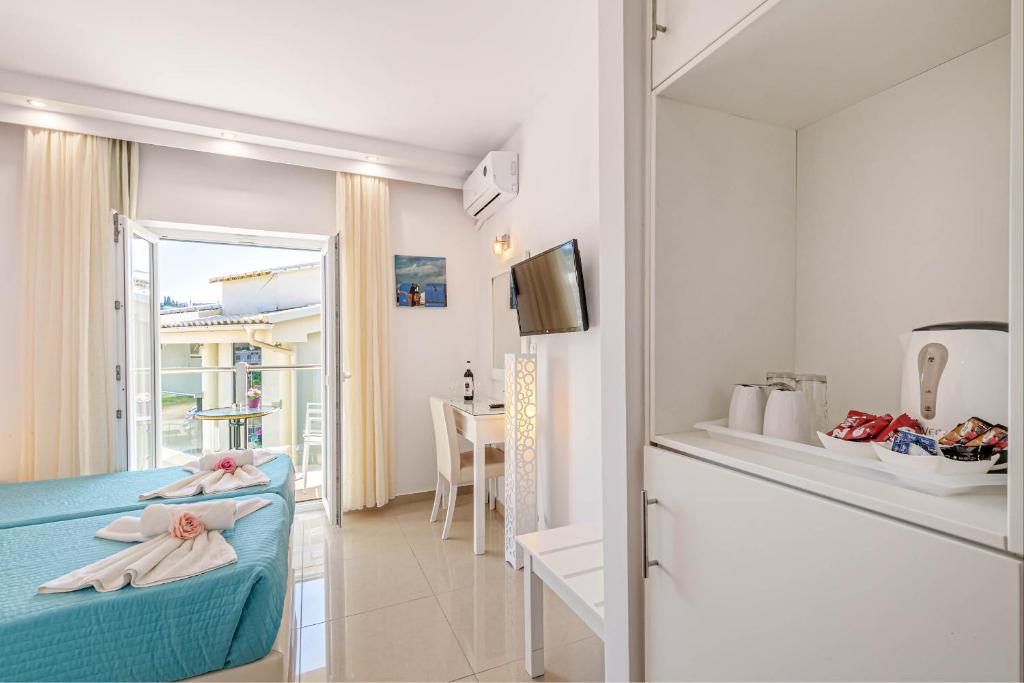 TV a/nebo společenská místnost v ubytování Palotel Design Gouvia