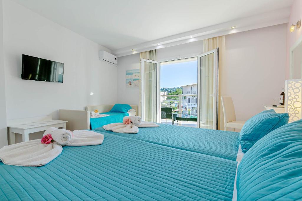 Postel nebo postele na pokoji v ubytování Palotel Design Gouvia