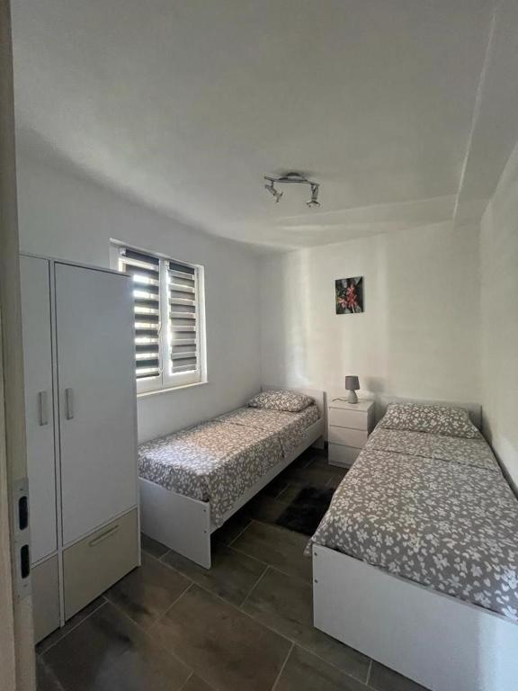 Posteľ alebo postele v izbe v ubytovaní Beachfront Holiday House Melissa