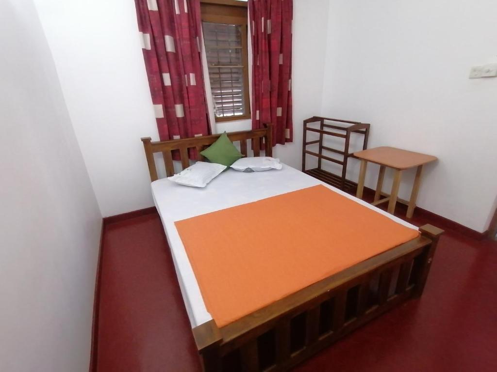 Postel nebo postele na pokoji v ubytování Sunshine Guest House