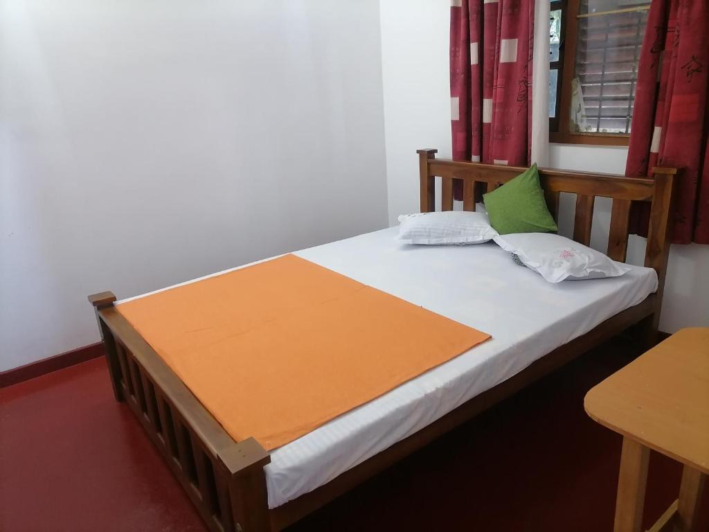 Postel nebo postele na pokoji v ubytování Sunshine Guest House