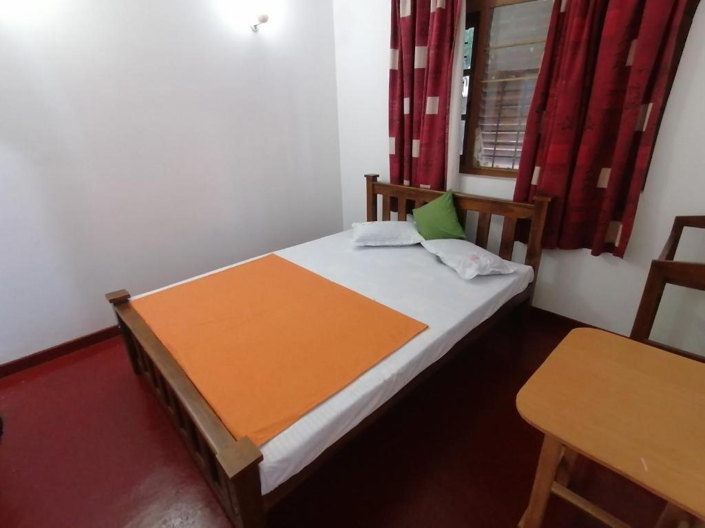 Postel nebo postele na pokoji v ubytování Sunshine Guest House