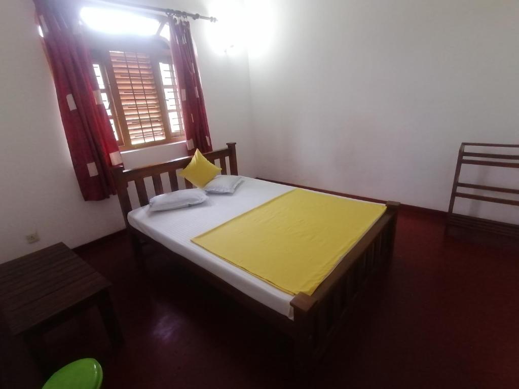 Postel nebo postele na pokoji v ubytování Sunshine Guest House