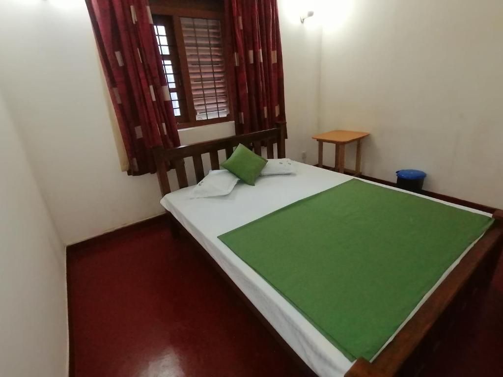 Postel nebo postele na pokoji v ubytování Sunshine Guest House