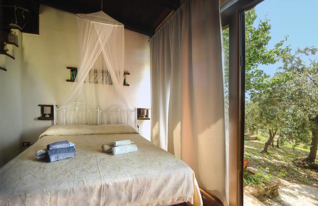 Postel nebo postele na pokoji v ubytování B&B La Torretta