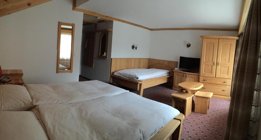Postel nebo postele na pokoji v ubytování Hotel City