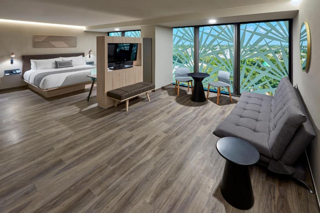 Postel nebo postele na pokoji v ubytování City Express Plus by Marriott Merida