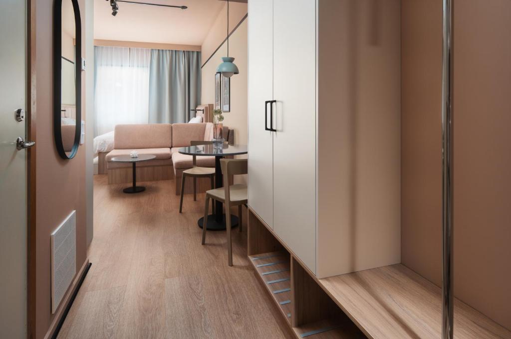 a room with a living room and a dining room at Sky Hotel Apartments, Stockholm in Stockholm