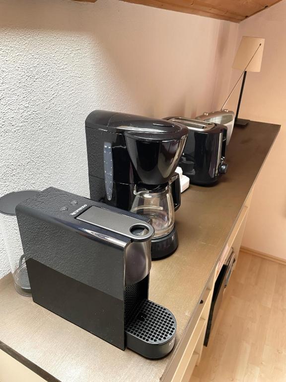 Příslušenství pro přípravu čaje a kávy v ubytování Appartement Aldea