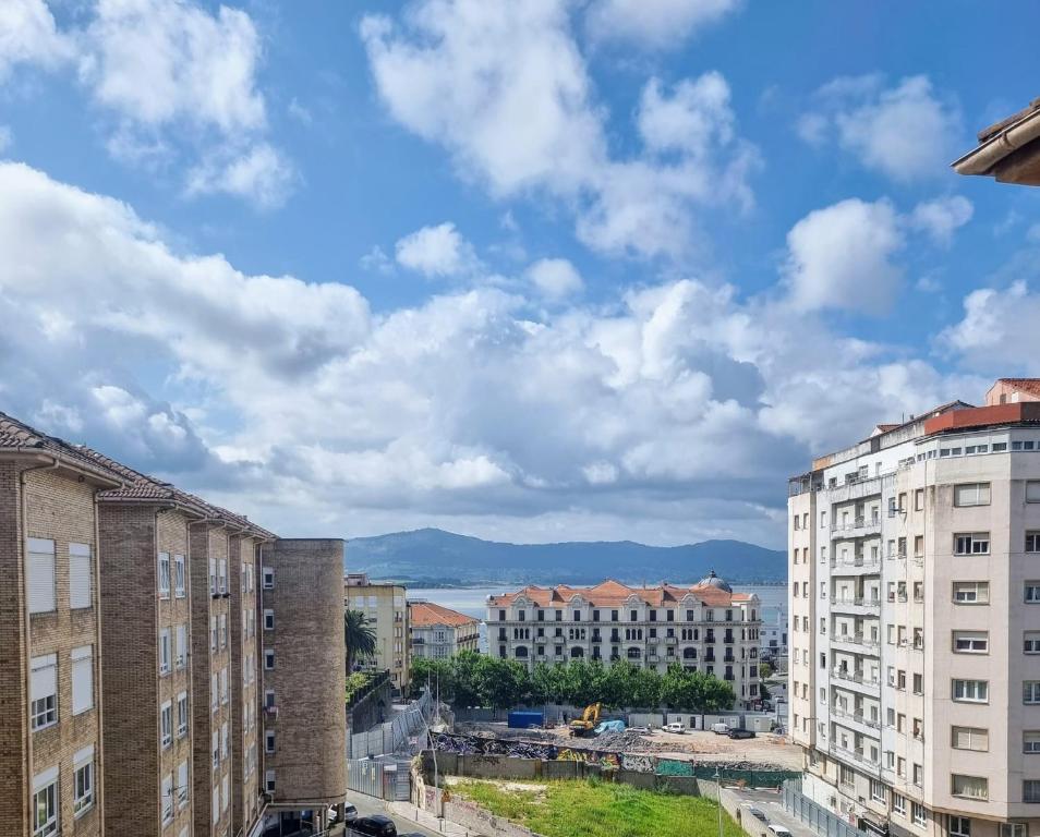 a view of a city with tall buildings at Habitación privada al lado de la bahía de Santander in Santander