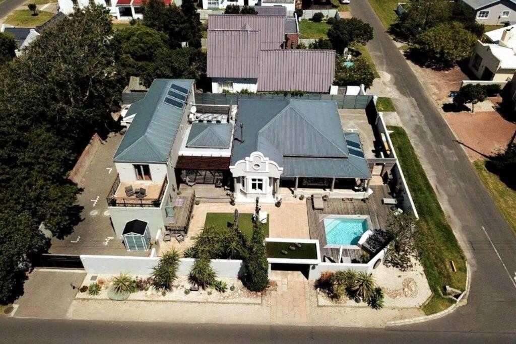 an aerial view of a house with a swimming pool at Onrus Beach House in Hermanus