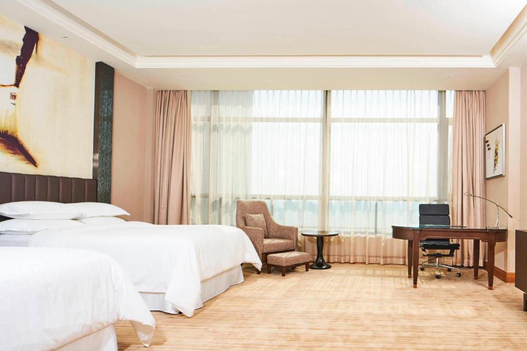 Postel nebo postele na pokoji v ubytování Sheraton Chuzhou Hotel