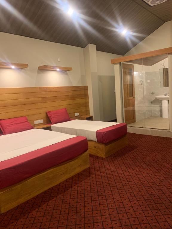 Postel nebo postele na pokoji v ubytování Pub Ceylon Hostel