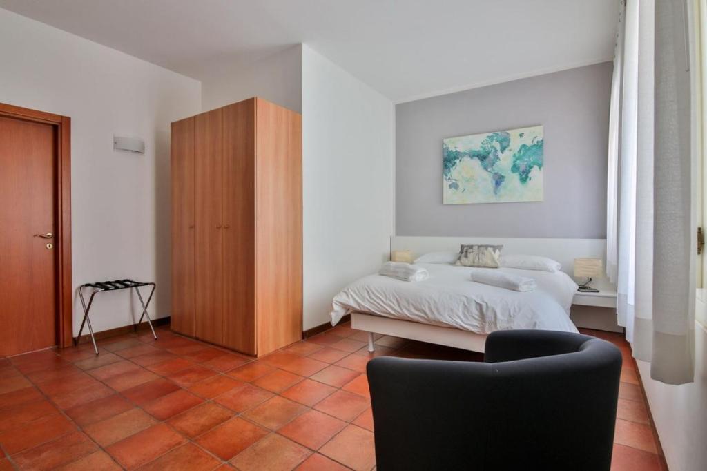 Postel nebo postele na pokoji v ubytování Residence Montegrappa