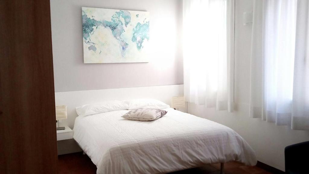 Postel nebo postele na pokoji v ubytování Residence Montegrappa