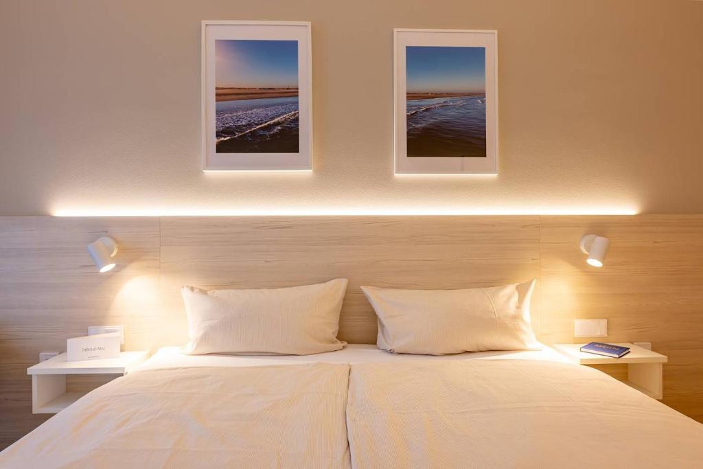 Postel nebo postele na pokoji v ubytování Hotel Stranddistel