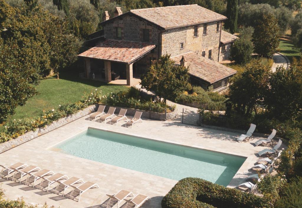 an aerial view of a house with a swimming pool at Villa Dorotea - Homelike Villas in Porano