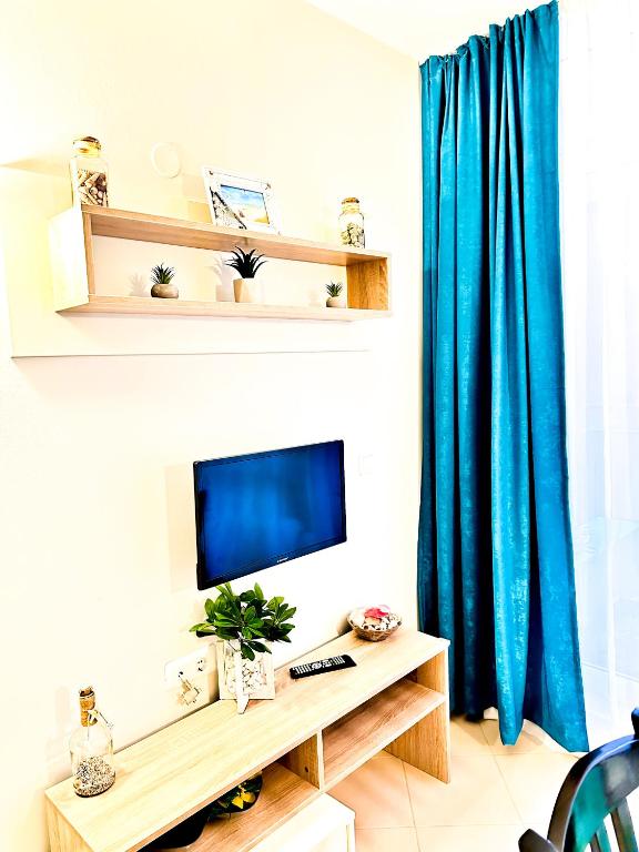 TV a/nebo společenská místnost v ubytování Apartment Nani -Sunny beach