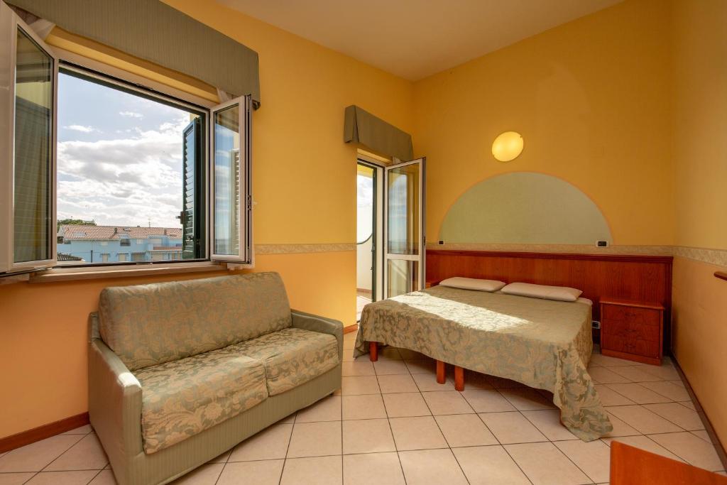 Postel nebo postele na pokoji v ubytování Hotel Roma Sul Mare
