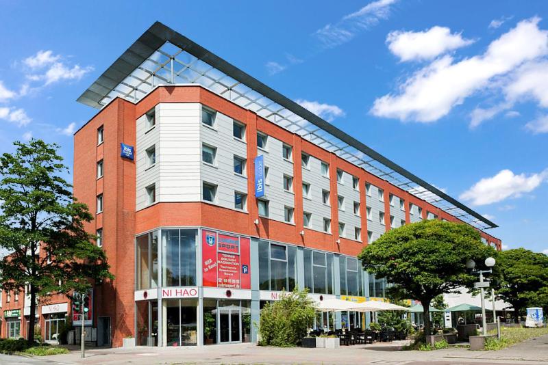 a large red brick building with at Ibis budget Hamburg City Ost in Hamburg