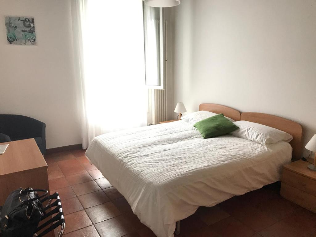 Postel nebo postele na pokoji v ubytování Residence Montegrappa