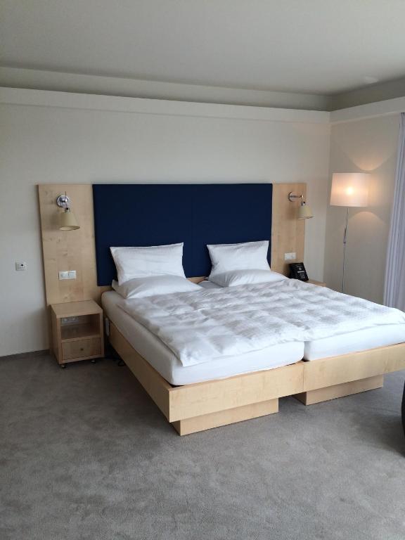 Postel nebo postele na pokoji v ubytování Hotel Erwin Junker