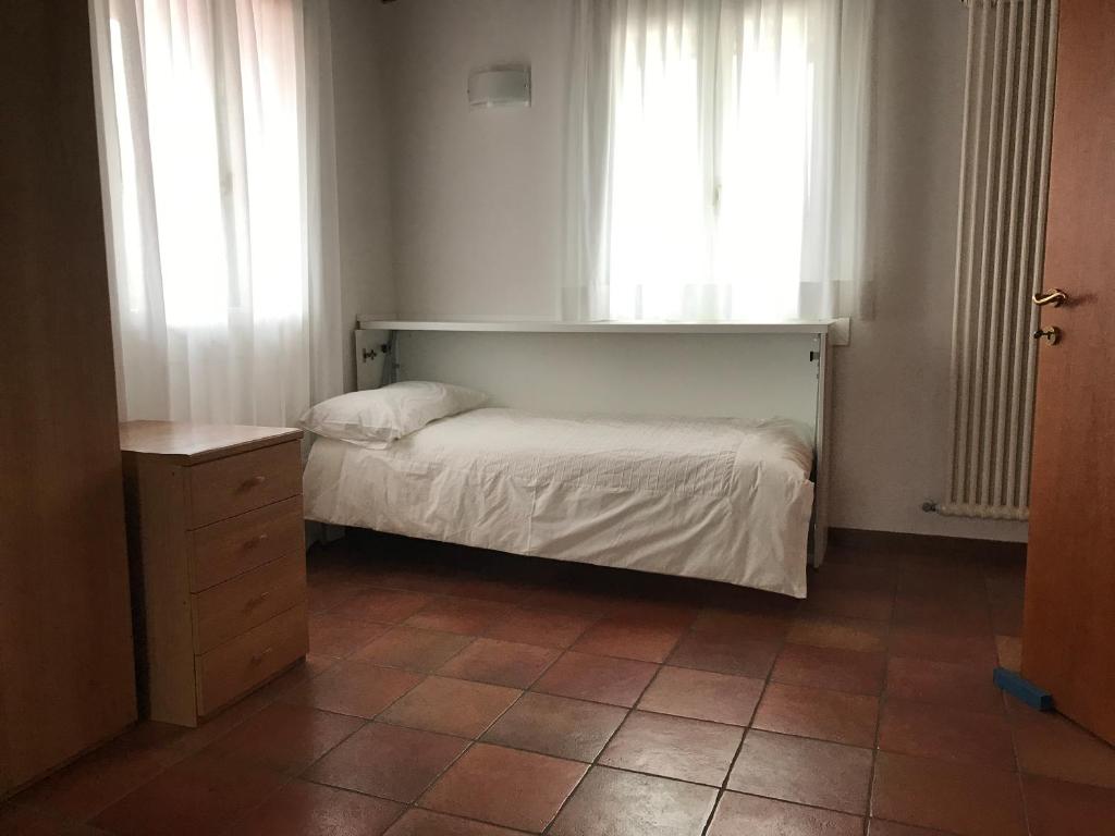 Postel nebo postele na pokoji v ubytování Residence Montegrappa