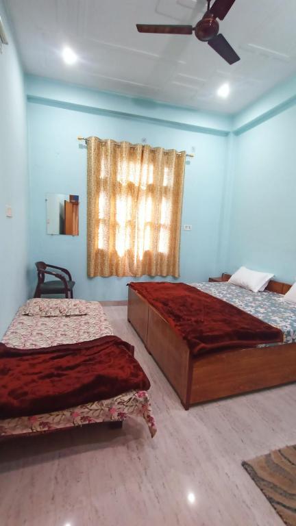 Voodi või voodid majutusasutuse ARJUN PAYING GUEST HOUSE toas