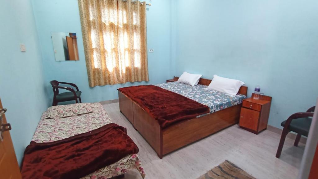 Voodi või voodid majutusasutuse ARJUN PAYING GUEST HOUSE toas