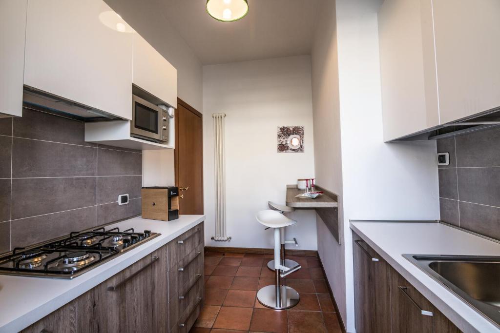 Kuchyň nebo kuchyňský kout v ubytování Residence Montegrappa