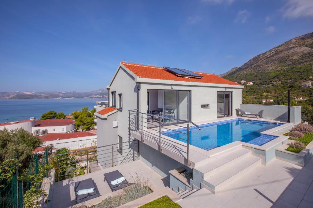 an aerial view of a house with a swimming pool at Villa Bellevue in Cavtat