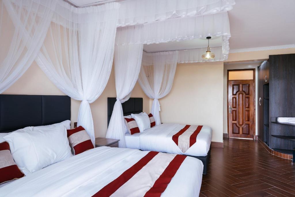 Postel nebo postele na pokoji v ubytování Olsupat Lodge