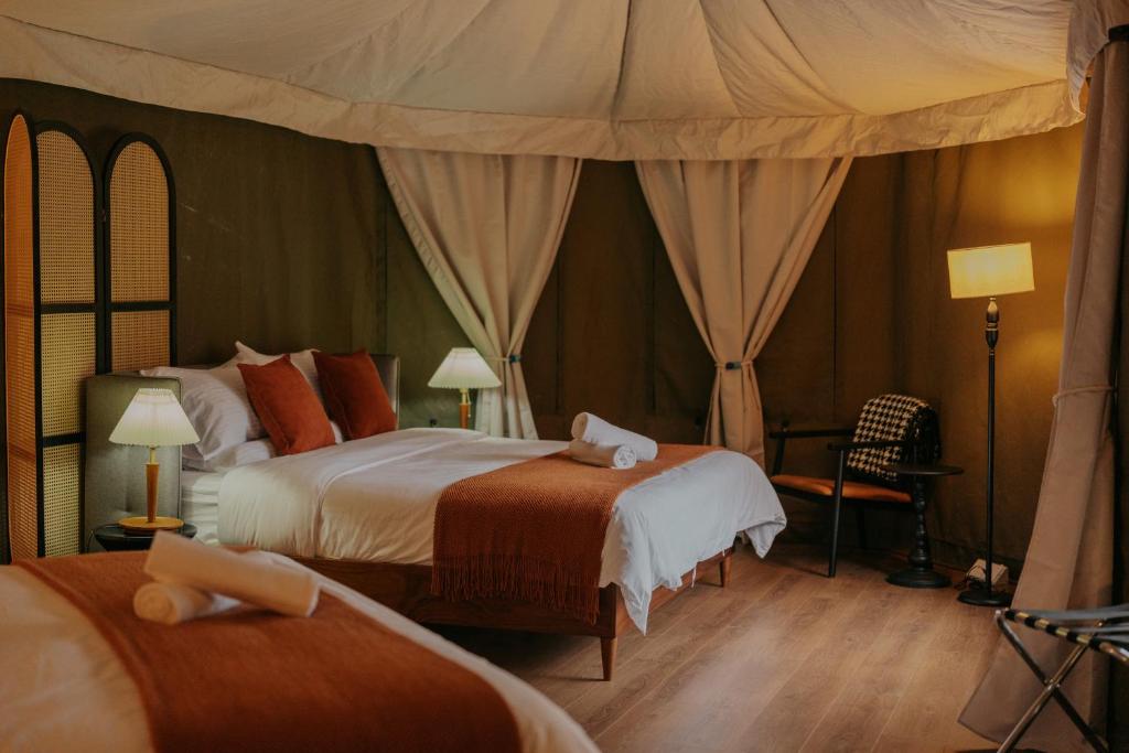Letto o letti in una camera di kMah@SomerMansion