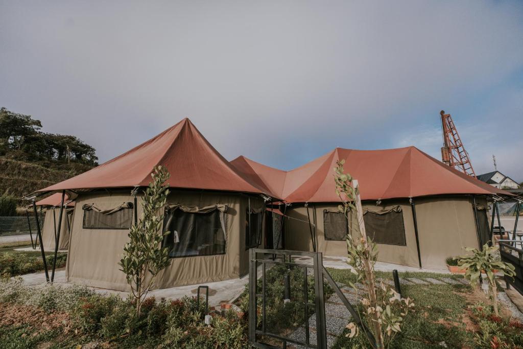 a large tent with a red roof at kMah@SomerMansion in Tanah Rata