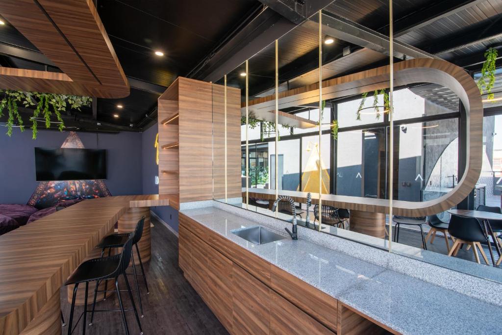 A shared kitchenette and bar counter beside a lounge area.