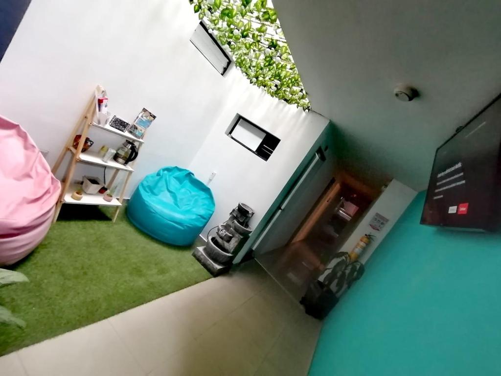 an overhead view of a room with a room with a window at Kromatic Hostel in Medellín