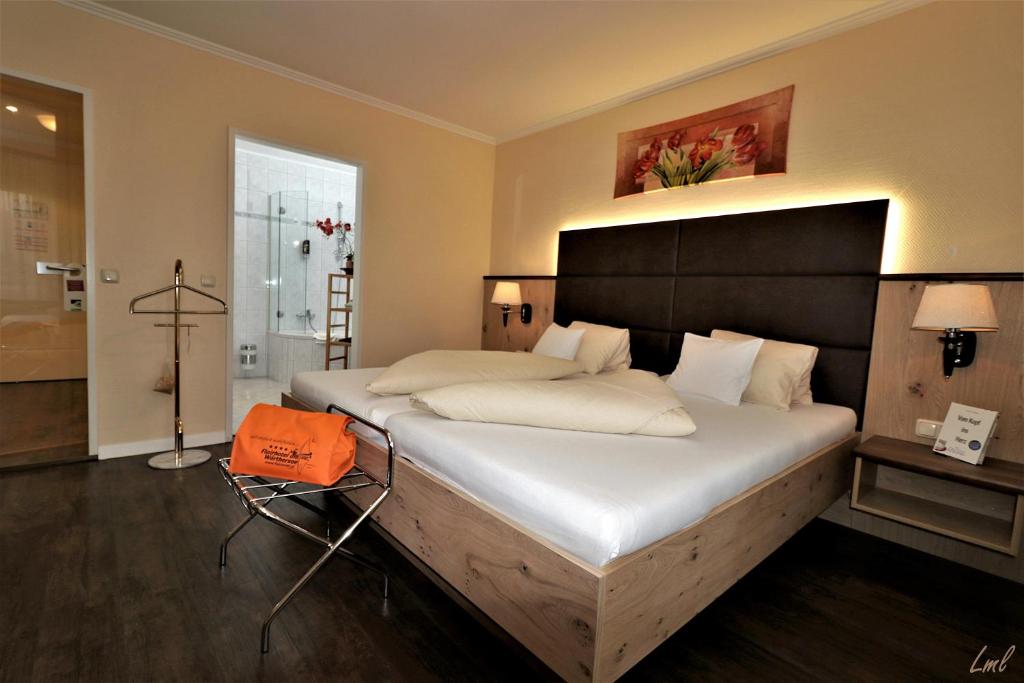 Posteľ alebo postele v izbe v ubytovaní Flairhotel am Wörthersee