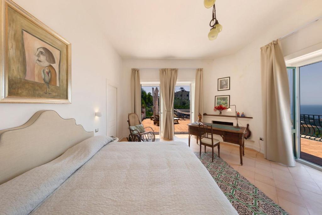 Postel nebo postele na pokoji v ubytování Villa Mundis Relais